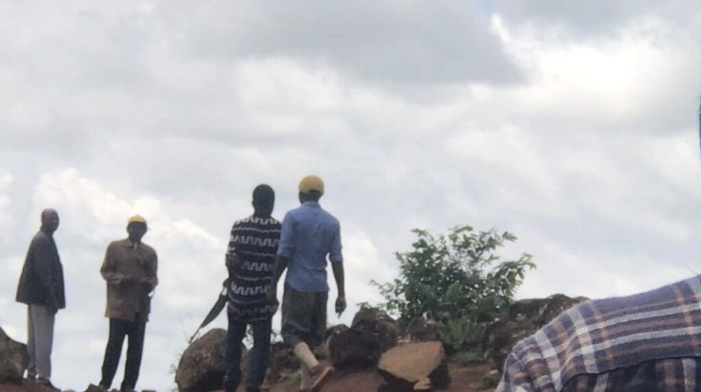 Vigilantes patrol bushes in a terrorized region of Plateau State on 9 July. Photo by Masara Kim.