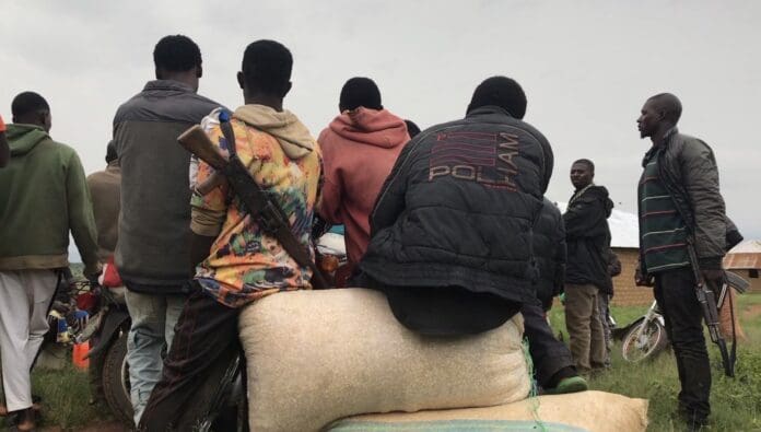 A band of citizen guards awaits news of a security threat June 18 in Plateau State, which neighbors Kaduna State. credit Masara Kim.