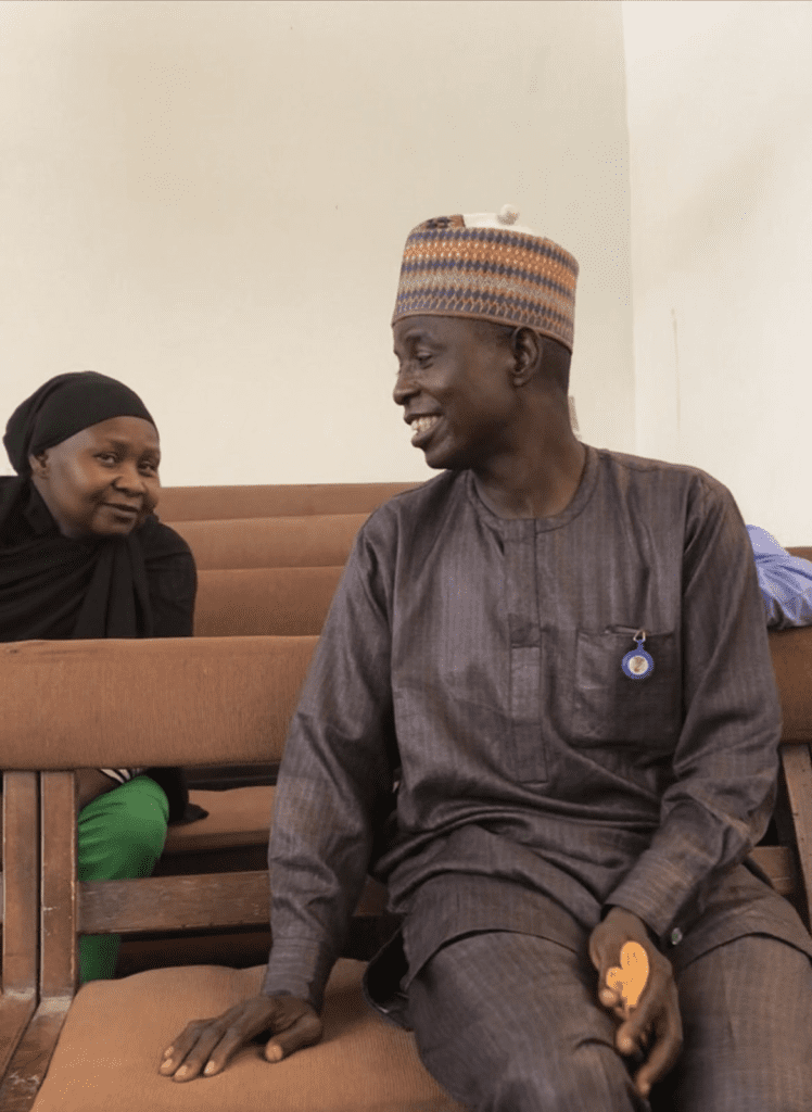 Rhoda Jatau Adamu, left sits in court behind her husband, Ya’u Adamu on Oct.16. credit: Masara Kim.