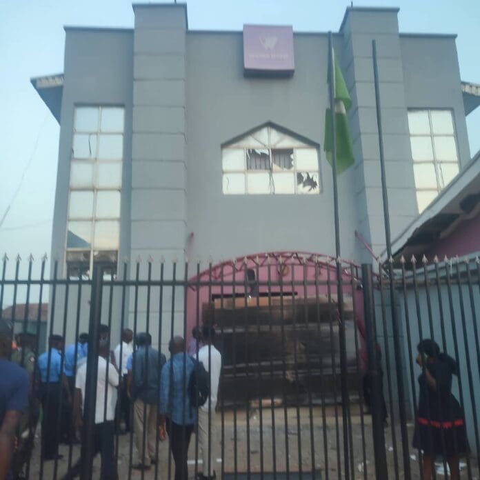 The Ekiti State Commissioner of Police, Ogundare Dare and some police officials at one of the robbed banks for an on-the-spot assessment. Credit: X/EkitiPoliceNG.