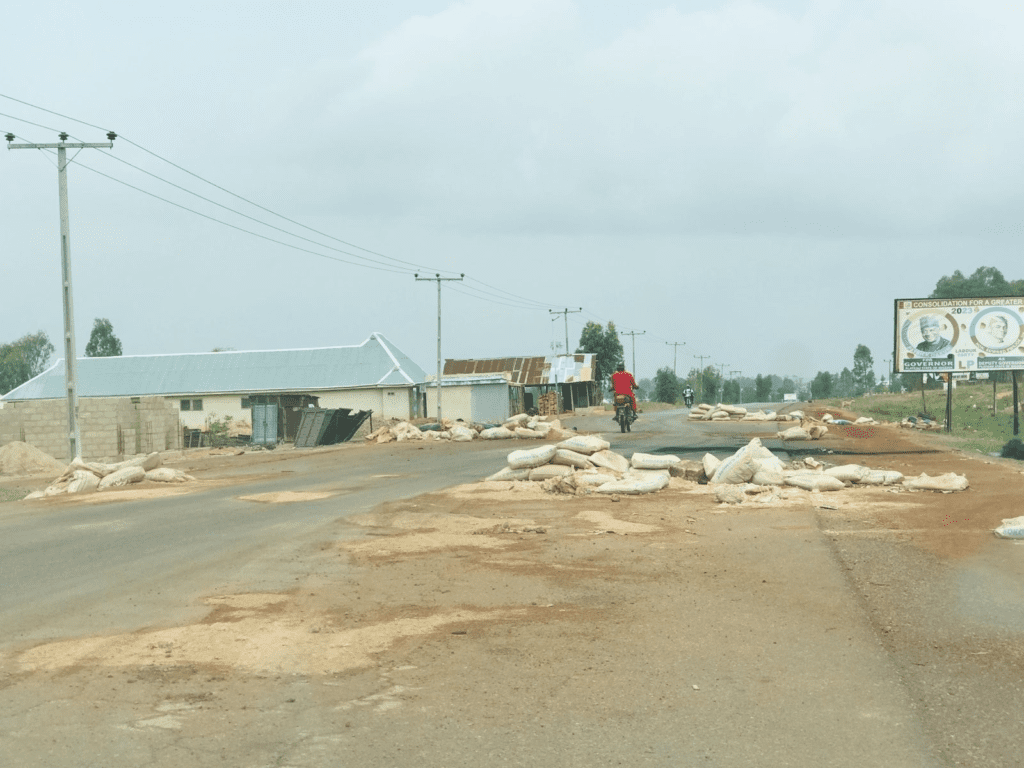Sandbags mark the remains of military checkpoint on campus of Plateau State University at Bokkos. credit: Masara Kim.