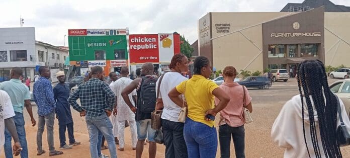 Stranded traders outside Banex plaza after soldiers restricted access on Monday. Photo credit: X/@TrustRadioLive.