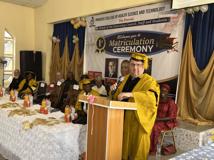 Mr. Judd Saul at commencement event for Health College he helped found near Abuja in 2022.