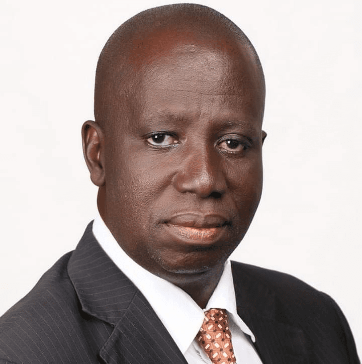 Simon Musa Reef, in suit and tie, pioneer news Editor of Blue Print now a media consultant and columnist with Leadership newspaper (credit: Simon Reef)  