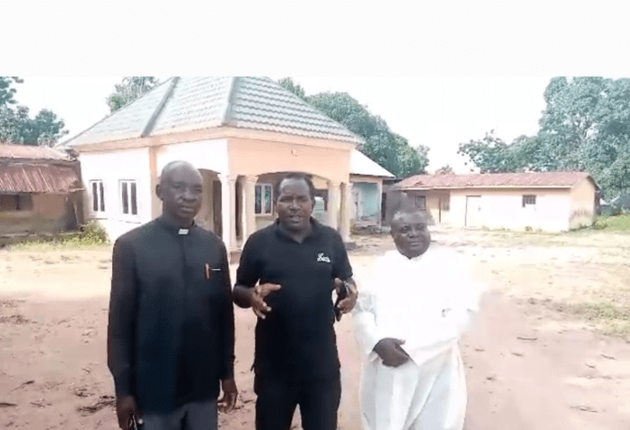 From left: Rev. Shimo Terlumun of Universal Reformed Christian Church (known as NKST), reporter Mike Odeh James, and Fr. Jacob Ankaau, pastor of St. Peter’s Parish in Ayati.