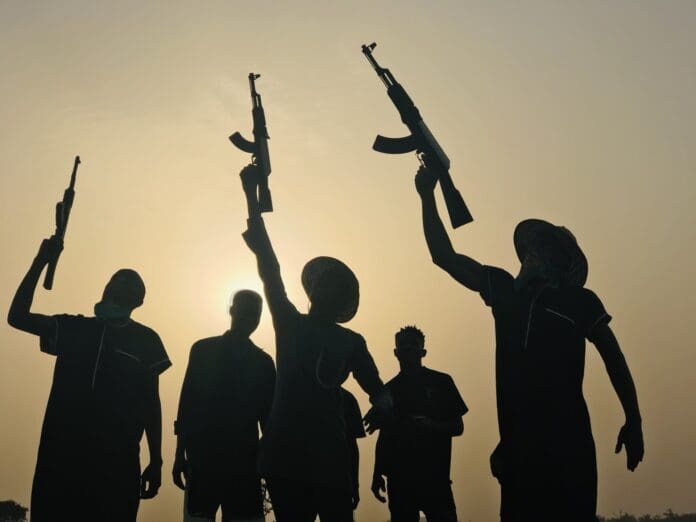 A re-enacted photo of Fulani terrorists celebrating victory after an attack. Credit Masara Kim