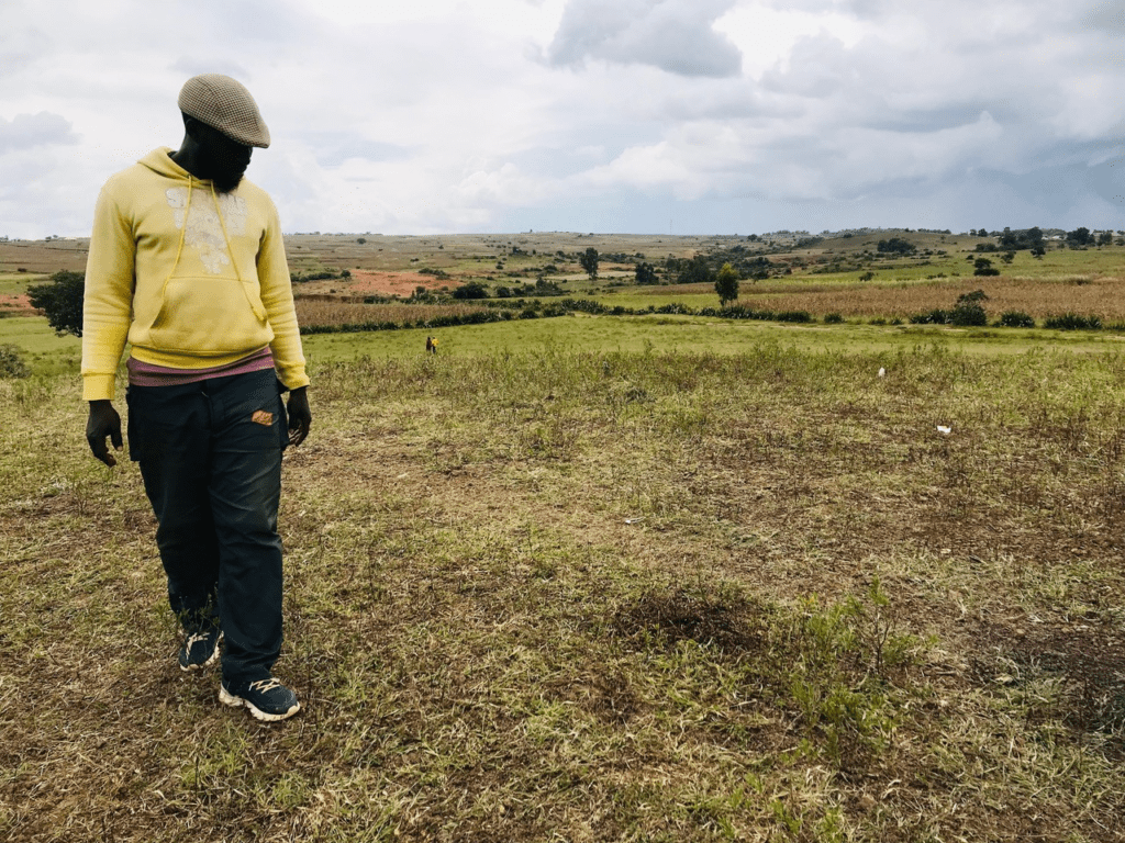 A civilian guard leader gazes at the scene of a bloody attack on a guard post that killed four members near Jos on October 14. Credit Masara Kim
