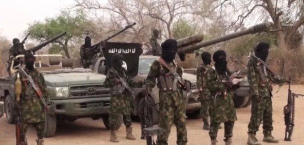 Boko Haram pose with ISIS flag. Courtesy: Boko Haram
