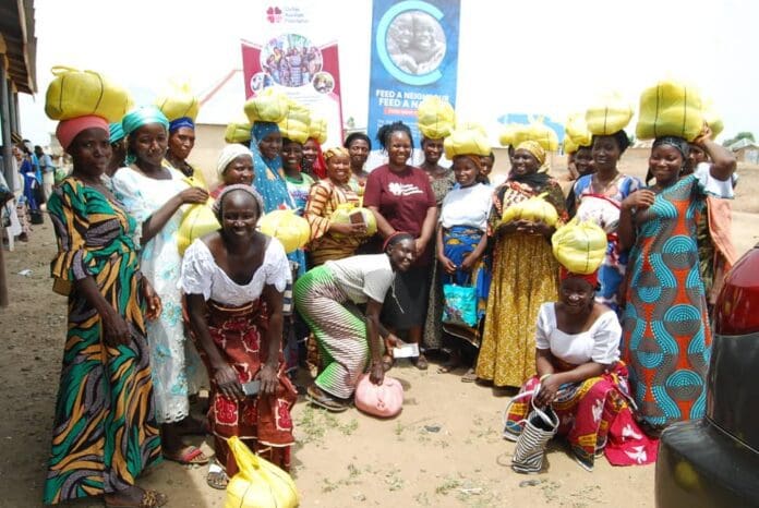 Duile with beneficiaries of CAF support. Photo credit: cafcares.org.