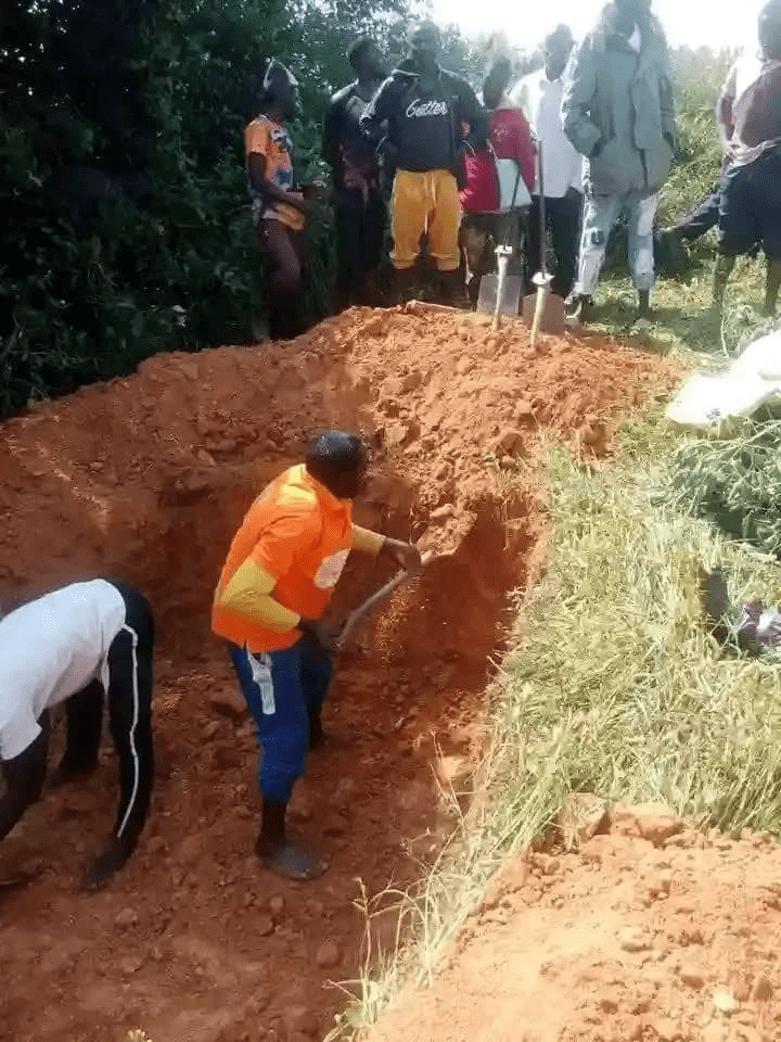 Residents dig a mass grave for five victims of terrorists attack in Kopmur, Mushere on October 22. Courtesy Ishaya Lalu.