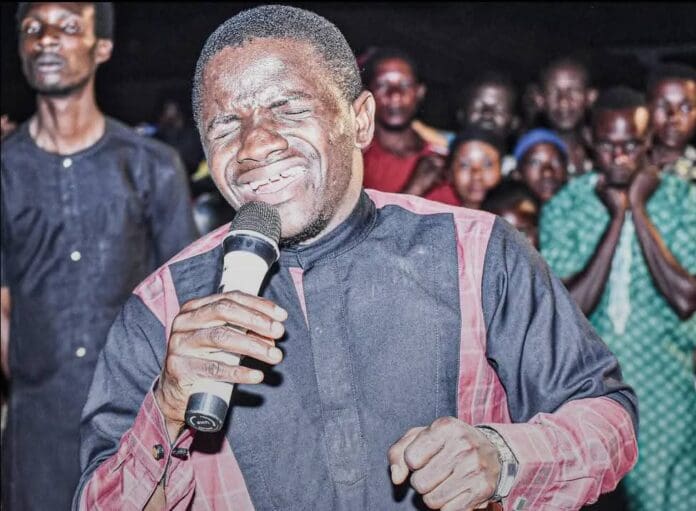 Picture of Evangelist Dr Ukpo Daniel at a crusade. Picture Courtesy: Evangelist Dr Ukpo Daniel media.