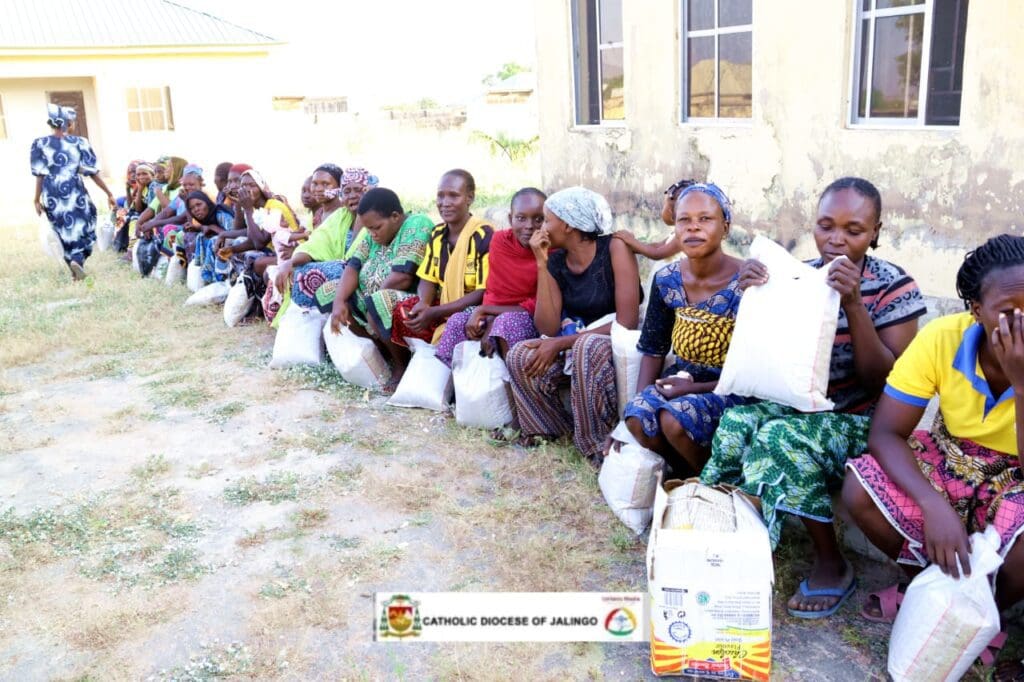IDPs receiving bags of rice donated by Equipping The Persecuted. Photo by Mike Odeh James.