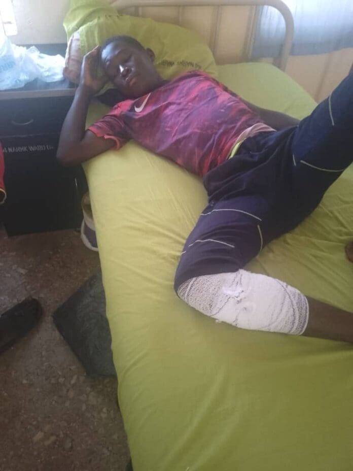 Amos Philip, 17, taking treatment at 44 Nigerian Army Referral Hospital, Kaduna after being shot by his father's (Rev Philip Adamu) abductors. (Credit Luka Binniyat)