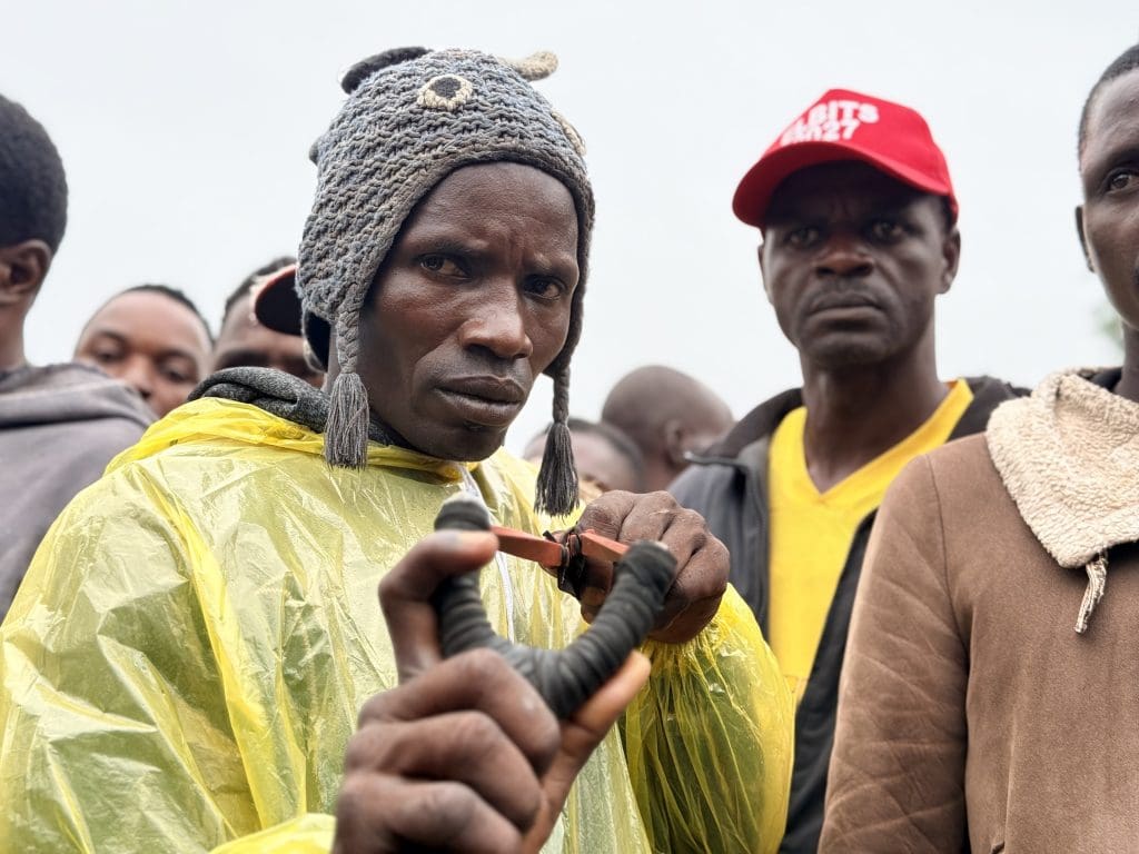 Sunday Ezekiel, youth leader of Gwom Ajang village aims with a slingshot after facing off against terrorists with assault rifles on May 31.
Credit Masara Kim