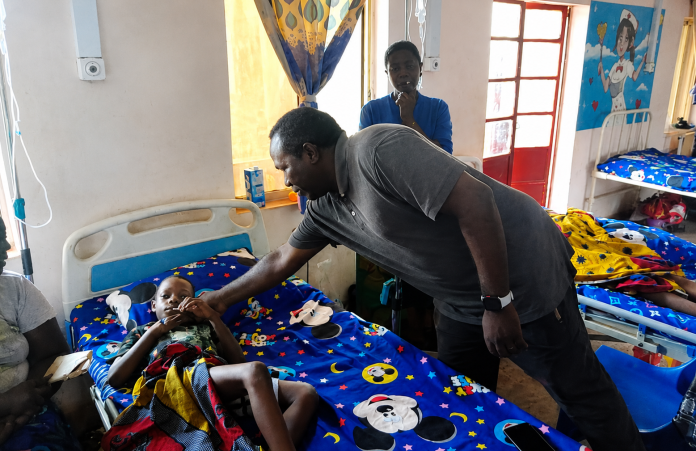 Little Michael who was shot multiple times is been condoled by ETP official Credit Mike Odeh James