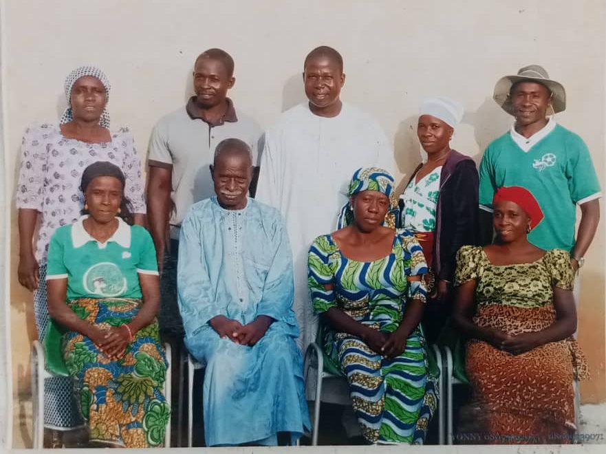 Isah Pateh Fulani Christian convert family picture. Standing (L-R): Rabi Isah, Sama'ila Isah, Ibrahim Isah, Tabitha Isah and Daniel Isah. Sitting (L-R): Fatima Isah, Isah Pateh, Jummai Isah, and Hajara Isah. Credit: Izhi Bitrus Adamu
