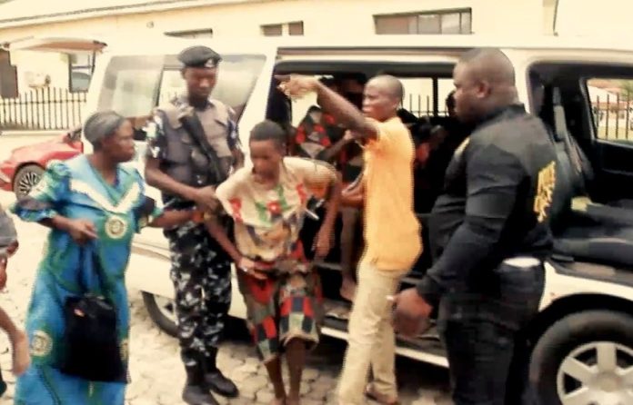 Picture showing a kidnap victim alighting from a bus being assisted by security operatives. Picture Culled from online video.